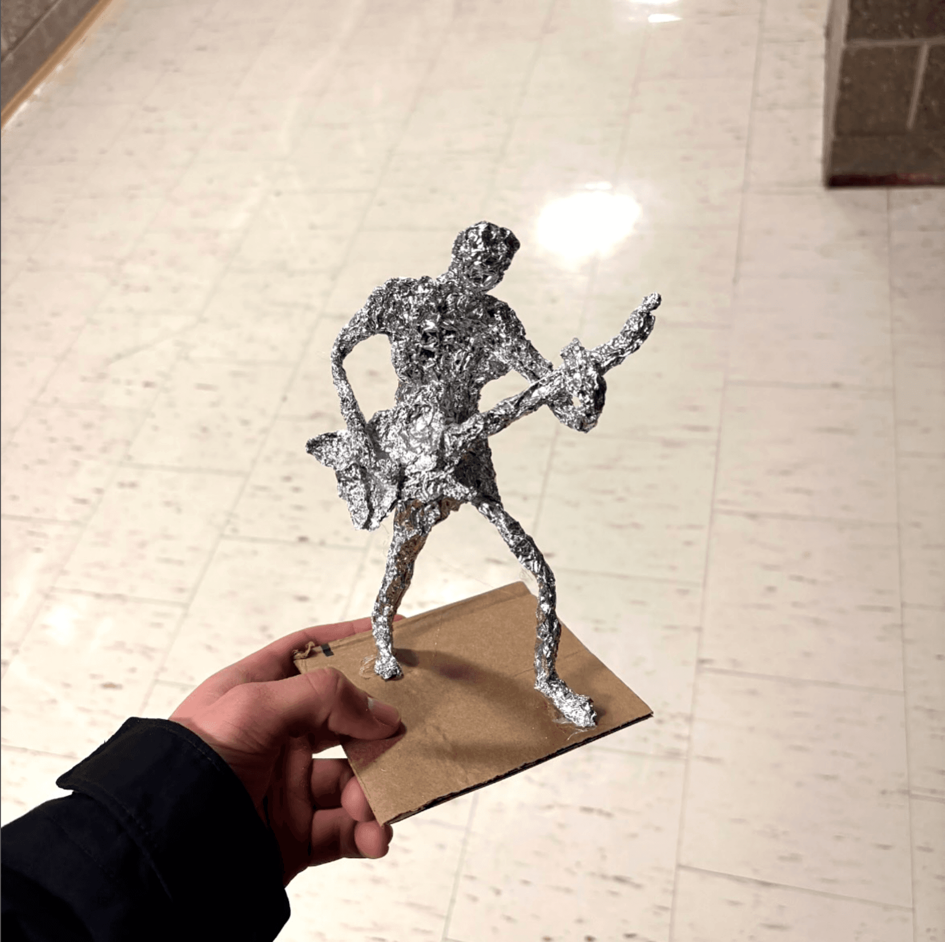 Aluminum foil guitarist